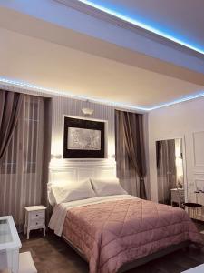 a bedroom with a king sized bed in a room at A&F Colosseo in Rome