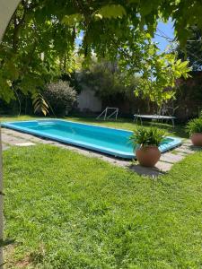 a swimming pool in the middle of a yard at Casa con pileta "TU CASITA EN VIEDMA" calle Junin 1877 in Viedma