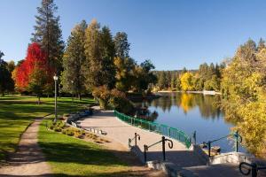 a park with a river and a path next to a lake at Western Skyline in Redmond
