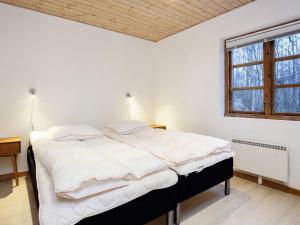 Ένα ή περισσότερα κρεβάτια σε δωμάτιο στο Holiday home Læsø