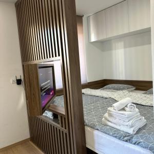Ένα ή περισσότερα κρεβάτια σε δωμάτιο στο Apartman 'Winterfell' Jahorina