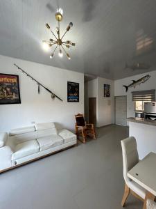 a living room with a white couch and a table at ALTAVITA in Puerto Colombia