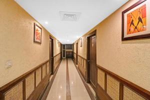 a corridor of a building with a long hallway at OYO Flagship Hotel park view 1 in Meerut