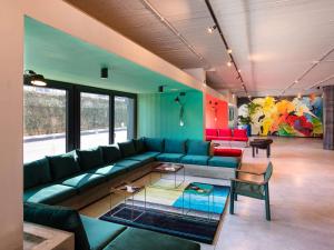 a living room with a couch and a table at Ibis Styles Roma Aurelia in Rome