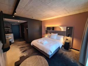 Mercure Hotel Delémont客房内的一张或多张床位