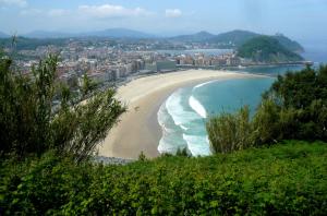 a view of a beach with a city in the background at Zurriola beach brand new apartment by Cisan Rentals in San Sebastián