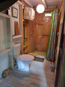 a bathroom with a toilet in a house at Mi pequeño Santuario in La Pedrera