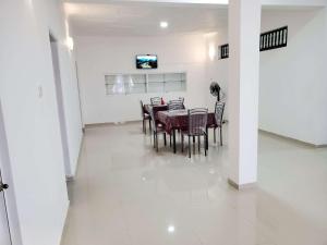 a dining room with a table and chairs at CITY VIEW KANDY - MPM APARTMENT 4A in Kandy
