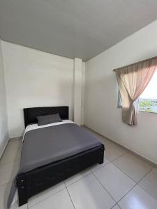 a bed in a white room with a window at ARMANI in Puerto Colombia