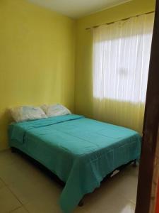 Postel nebo postele na pokoji v ubytování Recanto dos Mares ap. 2.