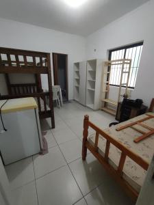 a room with two bunk beds in a room at Residência RCA13 in Santos