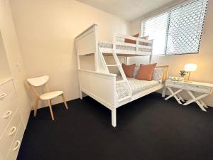 Ένα ή περισσότερα κρεβάτια σε δωμάτιο στο Craigmore 7 - Front Row Seats to Sunrise