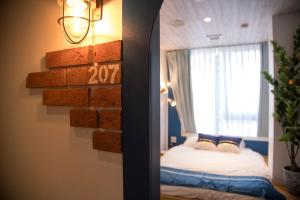 Postel nebo postele na pokoji v ubytování Glamping Tokyo Asakusa