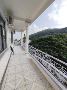 a balcony of a house with a view at Nhà Nghỉ SAO MAI in Ha Tien