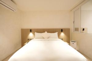 Postel nebo postele na pokoji v ubytování Hope Hotel Tainan