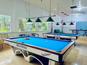 two pool tables in a billiard room in a house at Mai Phuong Resort Phu Quoc in Phu Quoc