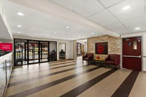 a lobby with two chairs and a waiting room at Red Roof Inn Martinsburg in Martinsburg