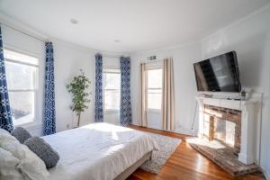 a living room with a bed and a fireplace at Spacious 2 Bed Apt in Atlanta near Piedmont Park in Atlanta