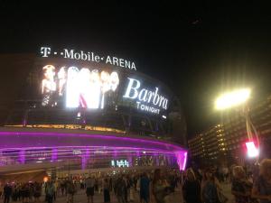 a crowd of people standing outside of a stadium at night at Amazing Deluxe 1-Bedroom - Next to Sphere in Las Vegas! in Las Vegas