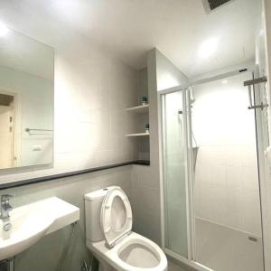 a bathroom with a shower and a toilet and a sink at Escent condo Chiangmai F17 in Chiang Mai