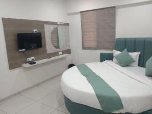 Televisyen dan/atau pusat hiburan di Hotel Md Residency