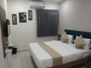 Katil atau katil-katil dalam bilik di Hotel Md Residency