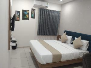 Postel nebo postele na pokoji v ubytování Hotel Md Residency + 27 fotografií