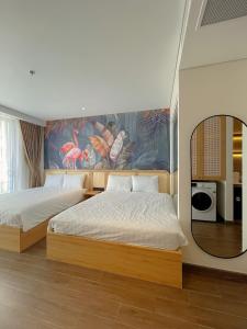 En eller flere senge i et værelse på QUEEN APEC MANDALA PHÚ YÊN