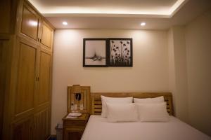 Postel nebo postele na pokoji v ubytování Senkotel Nha Trang Managed by NEST Group
