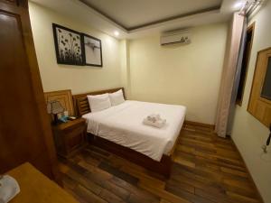 Postel nebo postele na pokoji v ubytování Senkotel Nha Trang Managed by NEST Group