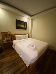 Postel nebo postele na pokoji v ubytování Senkotel Nha Trang Managed by NEST Group