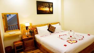 Postel nebo postele na pokoji v ubytování Senkotel Nha Trang Managed by NEST Group