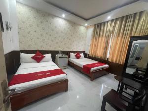 En eller flere senger på et rom på OYO 553 Truong Giang Hotel