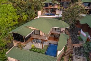 an overhead view of a house with a green roof at Simroseate in Agonda