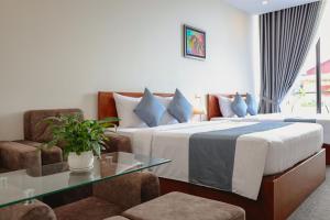 Ліжко або ліжка в номері Nimith Hotel & Restaurant
