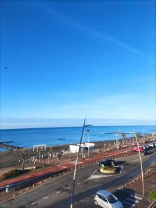 a parking lot with a beach and the ocean at Apartment with seaview in Lido di Ostia
