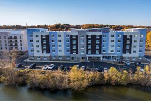 an aerial view of a hotel with cars parked in a parking lot at TownePlace Suites by Marriott Richmond Colonial Heights in Colonial Heights