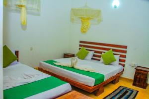 Letto o letti in una camera di Banana Rest Sigiriya