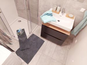 a bathroom with a sink and a shower at Eni-Time Mariazell in Mariazell