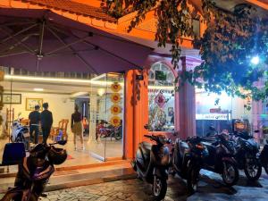 a group of motorcycles parked in front of a store at Nhat Quynh Hotel in Da Lat