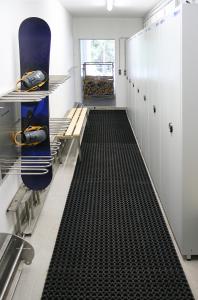 a room with a black floor in a kitchen at Appartementhaus Leeder by Schladming-Appartements in Schladming