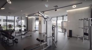 a gym with treadmills and machines in a building at City Lookout with Amenities in Melbourne