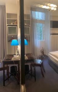 Postel nebo postele na pokoji v ubytování Hotel Olympic