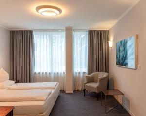Postel nebo postele na pokoji v ubytování Hotel Olympic