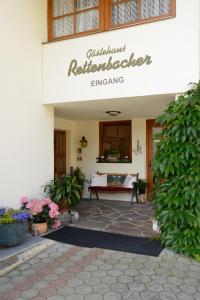 a building with a bench in front of it at Gästehaus Rettenbacher in Fulpmes