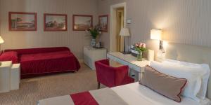 Postel nebo postele na pokoji v ubytování Hotel dei Borgognoni