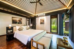 Ein Bett oder Betten in einem Zimmer der Unterkunft Hon Tam Resort