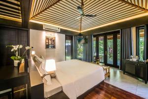 Ein Bett oder Betten in einem Zimmer der Unterkunft Hon Tam Resort