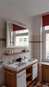 a bathroom with a sink and a window at Inn den Acht Venlo in Venlo