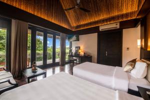 Ein Bett oder Betten in einem Zimmer der Unterkunft Hon Tam Resort